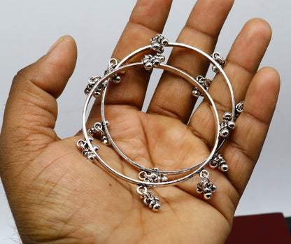 Sterling silver bridesmaid bangle bracelet with hanging bells, handcrafted by TRIBAL ORNAMENTS, personalized wedding jewelry.