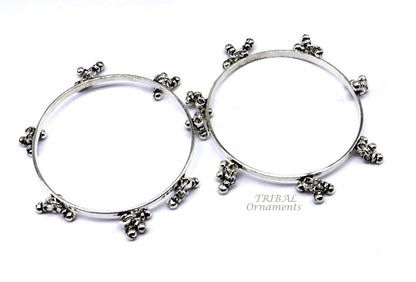Sterling silver bridesmaid bangle bracelet with hanging bells, handmade and personalized by TRIBAL ORNAMENTS for wedding gifting.
