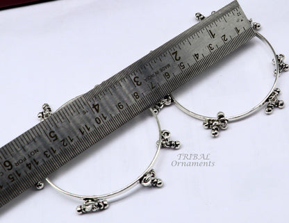 Sterling silver bridal bangle bracelet with hanging bells, handcrafted by TRIBAL ORNAMENTS, perfect for bridesmaids and personalized gifting.