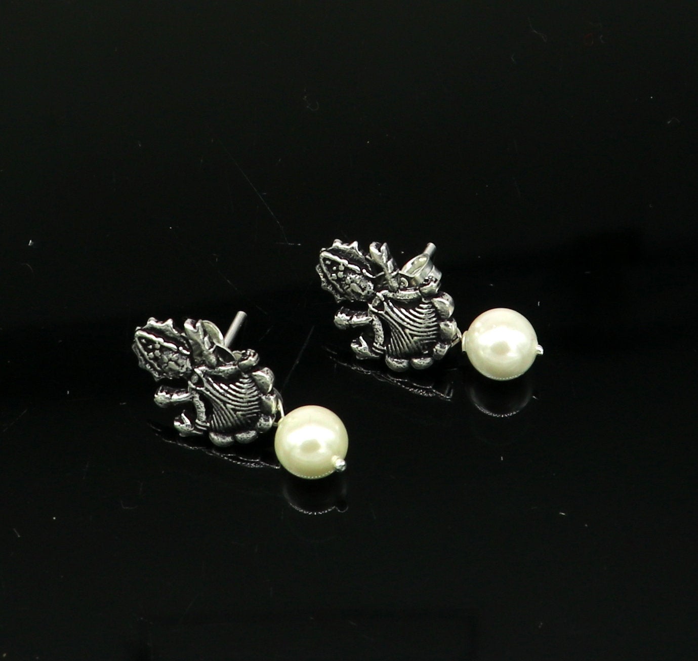 Sterling silver tribal deity goddess stud earring with dangling mother of pearl, handcrafted by Tribal Ornaments.
