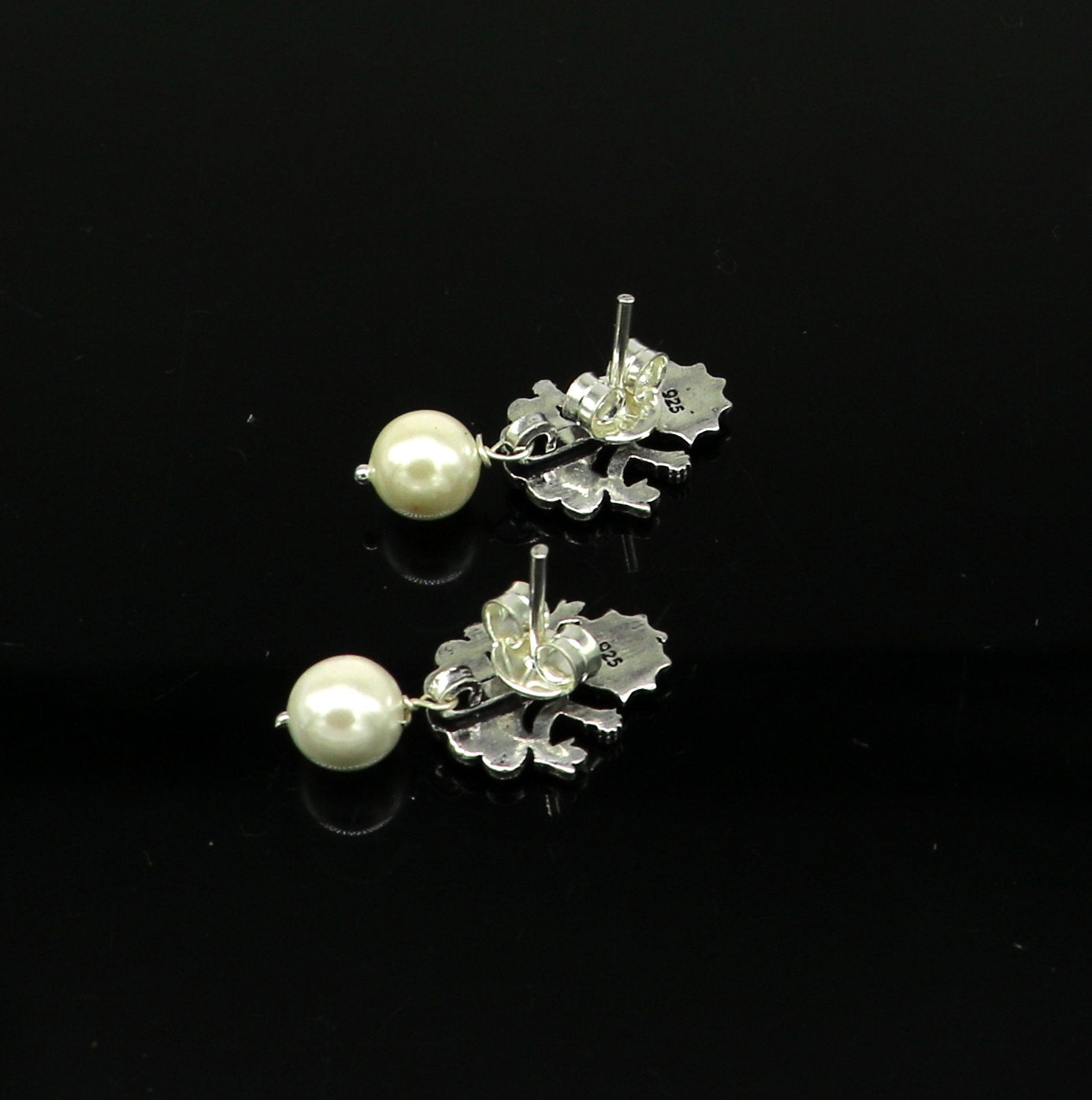 Sterling silver tribal goddess stud earring with dangling mother of pearl, handcrafted by Tribal Ornaments.