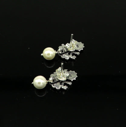 Sterling silver tribal goddess stud earring with dangling mother of pearl, handcrafted by Tribal Ornaments.