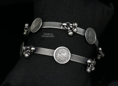 Sterling silver ethnic bangle bracelet with vintage style hanging drops, handmade by TRIBAL ORNAMENTS, perfect for gifting.