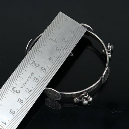 Sterling silver tribal ethnic bangle bracelet with vintage style hanging drops, handcrafted by TRIBAL ORNAMENTS.