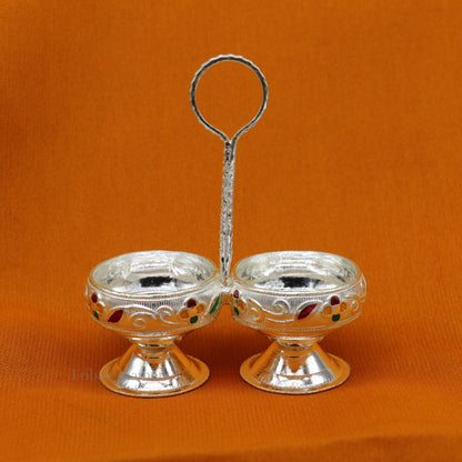 Sterling silver handmade puja utensils including tilak bowl and kumkum patra, crafted by TRIBAL ORNAMENTS.