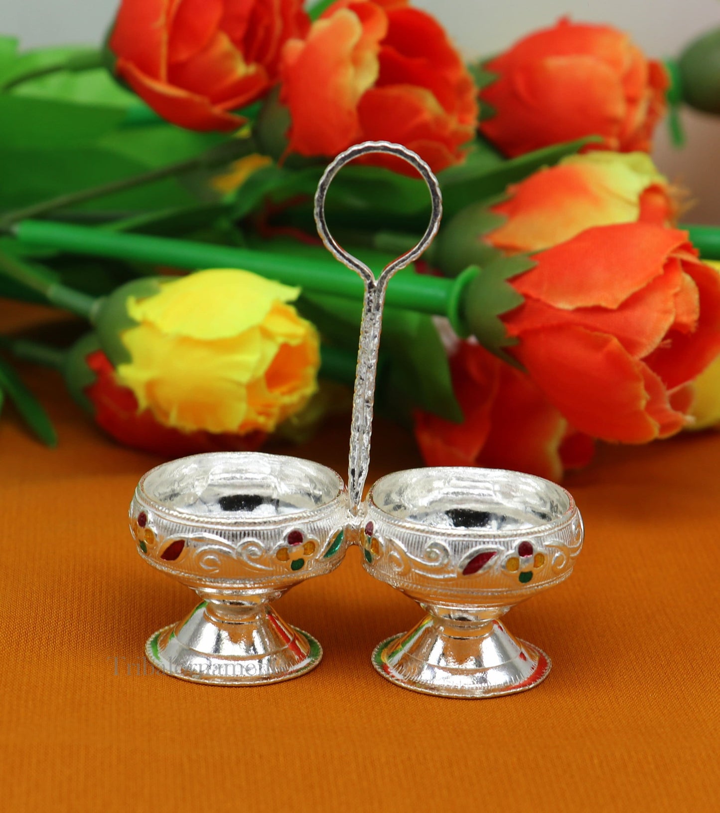 Handmade 925 sterling silver puja utensils including tilak bowl and kumkum patra with customized tribal design.