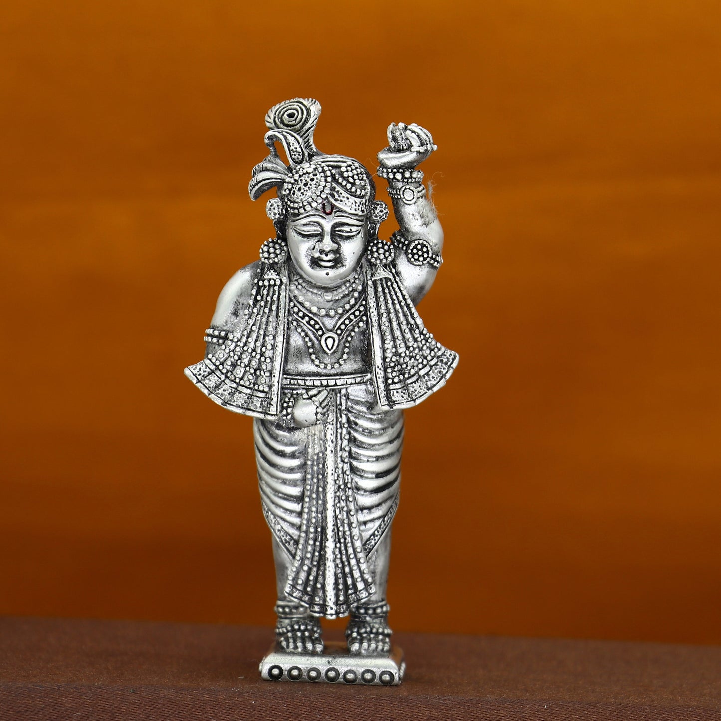 Handmade 925 sterling silver Krishna Govardhan idol figurine for puja, decorative gift, and Diwali celebration from Tribal Ornaments.