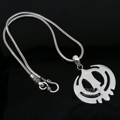 925 sterling silver Holy Khalsa Waheguru pendant featuring Sikh Sardar symbol, handmade design, religious jewelry from India.