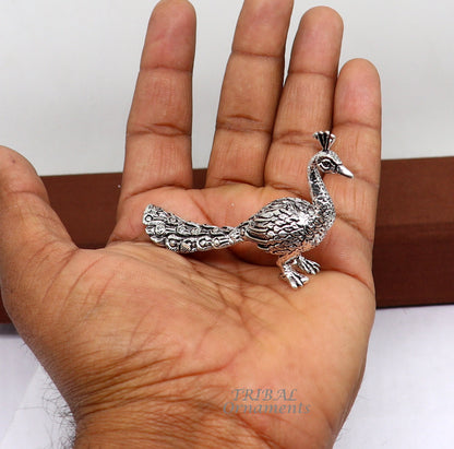 Handmade 925 sterling silver peacock statue for home temple, depicting Lord Kartikeya's vahan, crafted by Tribal Ornaments.