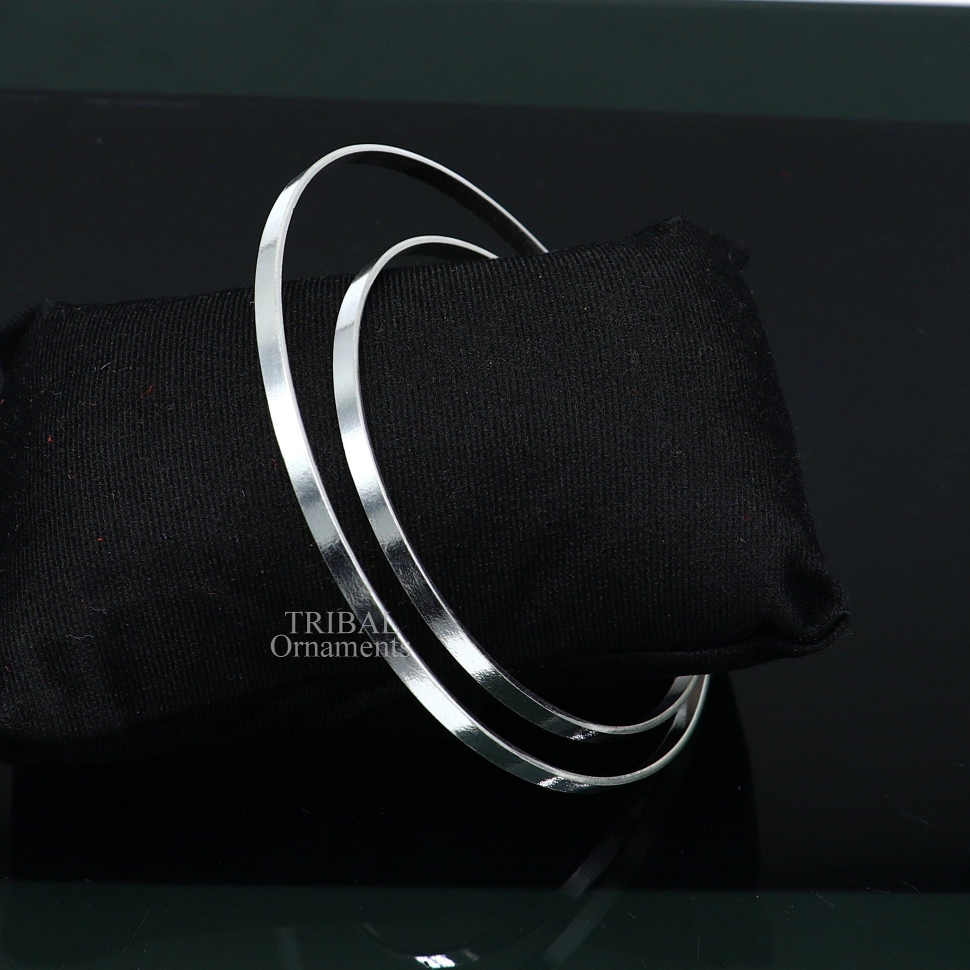 Sterling silver double-layer bangle bracelet with plain design, handmade tribal jewelry for women from India.