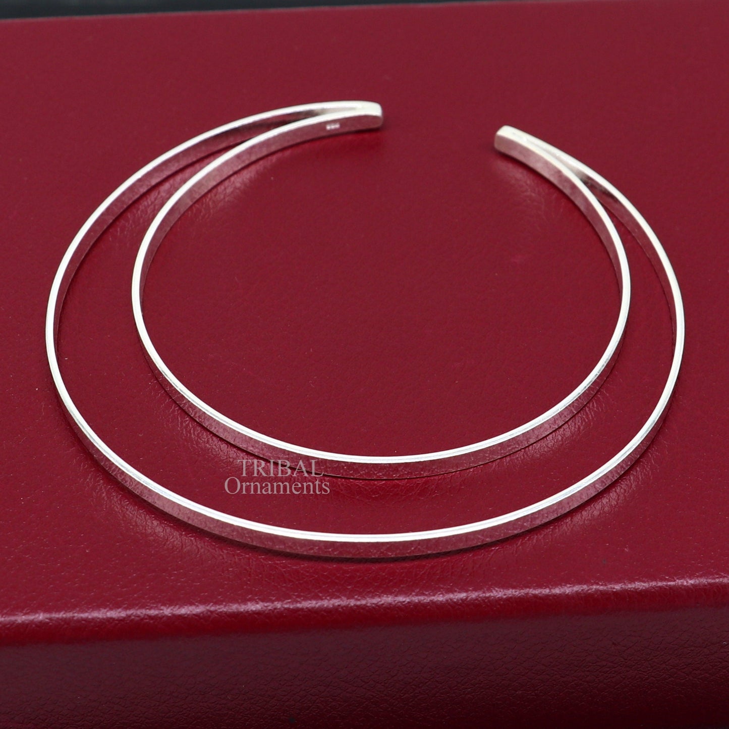 Sterling silver double layer plain bangle bracelet from TRIBAL ORNAMENTS, showcasing a sleek, handmade cuff design with tribal jewelry style.