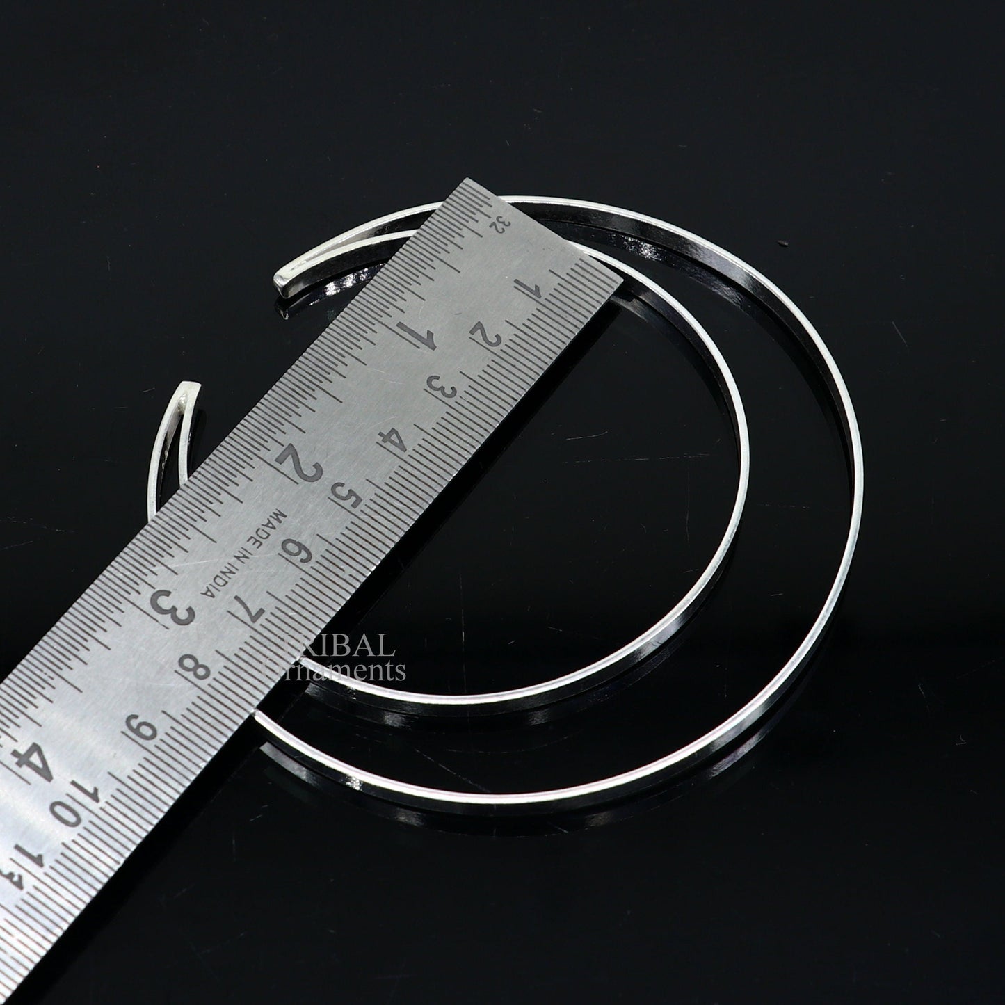 Sterling silver double layer plain design bangle bracelet by TRIBAL ORNAMENTS, featuring a sleek, handmade cuff style jewelry piece.