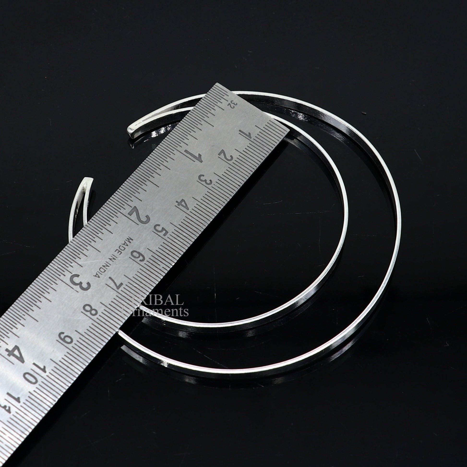Sterling silver double layer plain design bangle bracelet by TRIBAL ORNAMENTS, featuring a sleek, handmade cuff style jewelry piece.