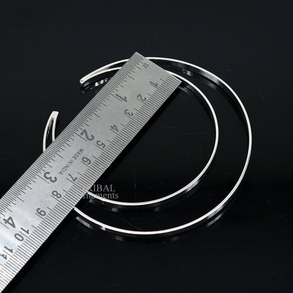 Sterling silver double layer plain design bangle bracelet by TRIBAL ORNAMENTS, featuring a sleek, handmade cuff style jewelry piece.
