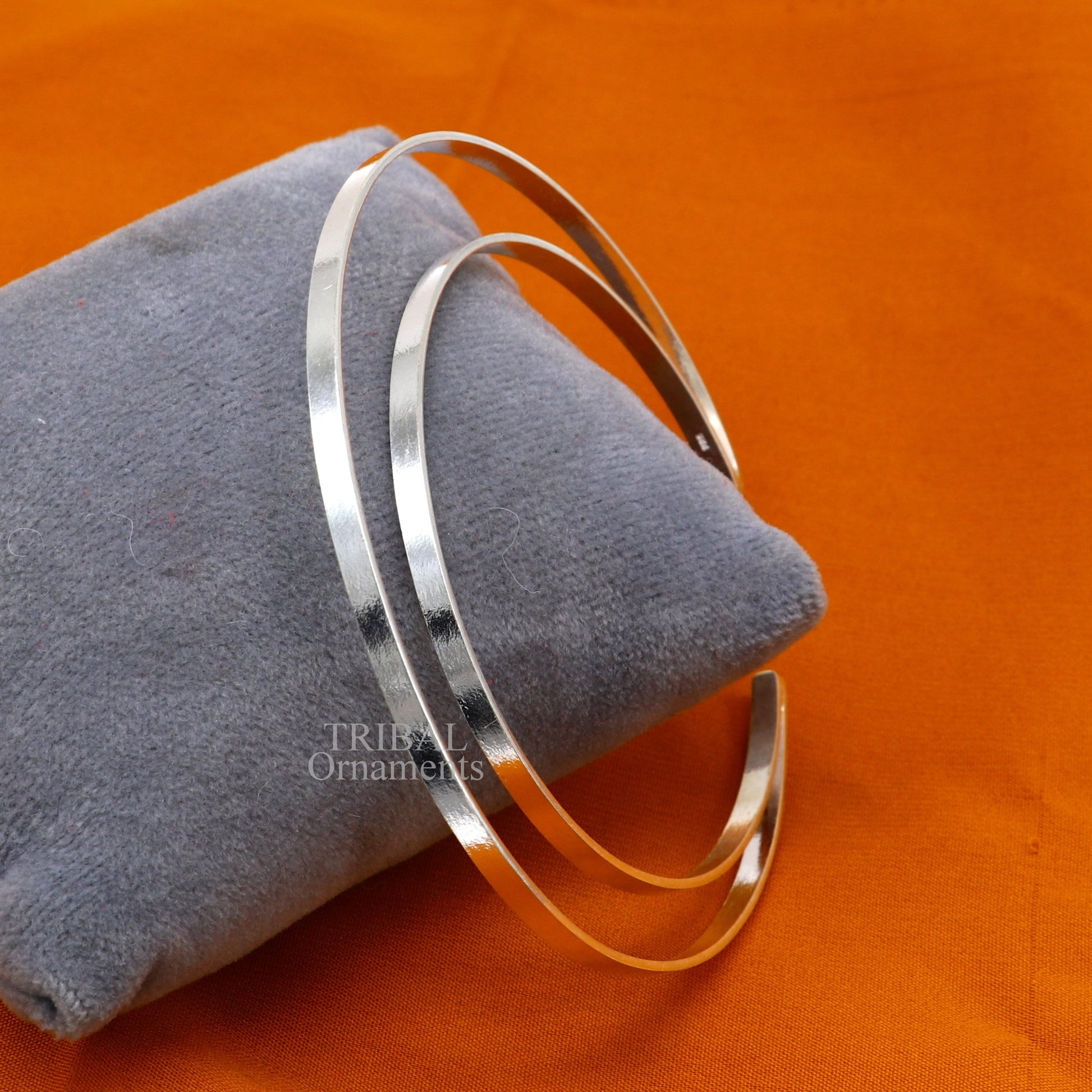 Sterling silver double-layer plain bangle bracelet by TRIBAL ORNAMENTS, featuring a sleek handmade cuff design with tribal jewelry style.