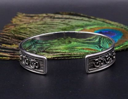 Unisex 925 sterling silver "AUM" Mantra cuff bangle bracelet with oxidized finish, adjustable design, handcrafted by TRIBAL ORNAMENTS.