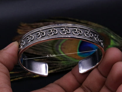 Unisex 925 sterling silver "AUM" Mantra cuff bangle bracelet with oxidized finish, adjustable and handmade by Tribal Ornaments.