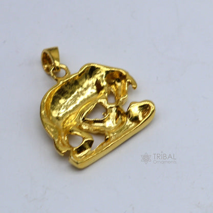 Elegant 925 sterling silver Kamdhenu cow with calf pendant from TRIBAL ORNAMENTS, featuring gold-polished details and intricate craftsmanship.
