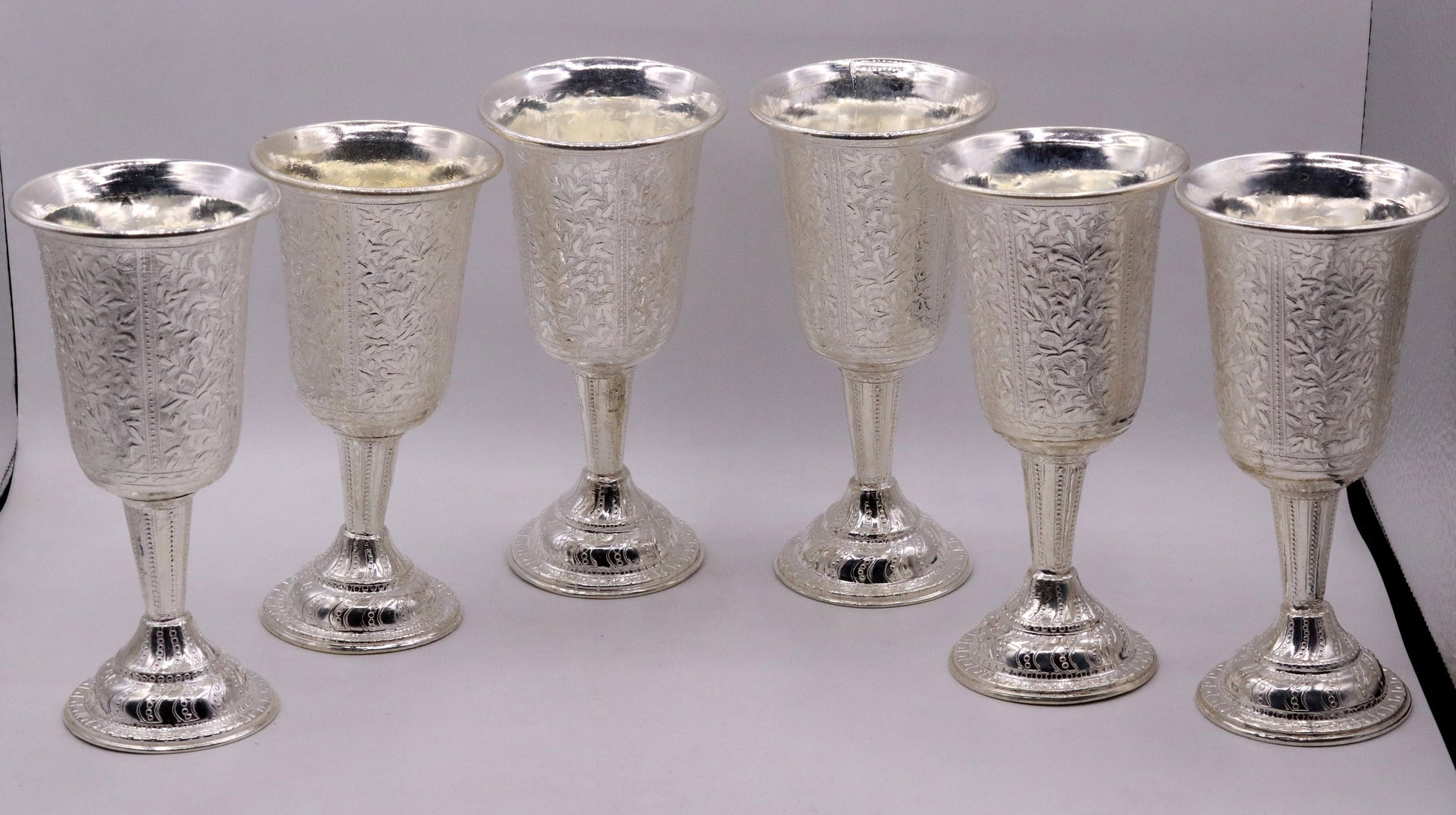 Set of 6 sterling silver wine glasses with engraved floral design by TRIBAL ORNAMENTS, handcrafted silver drinking glasses.
