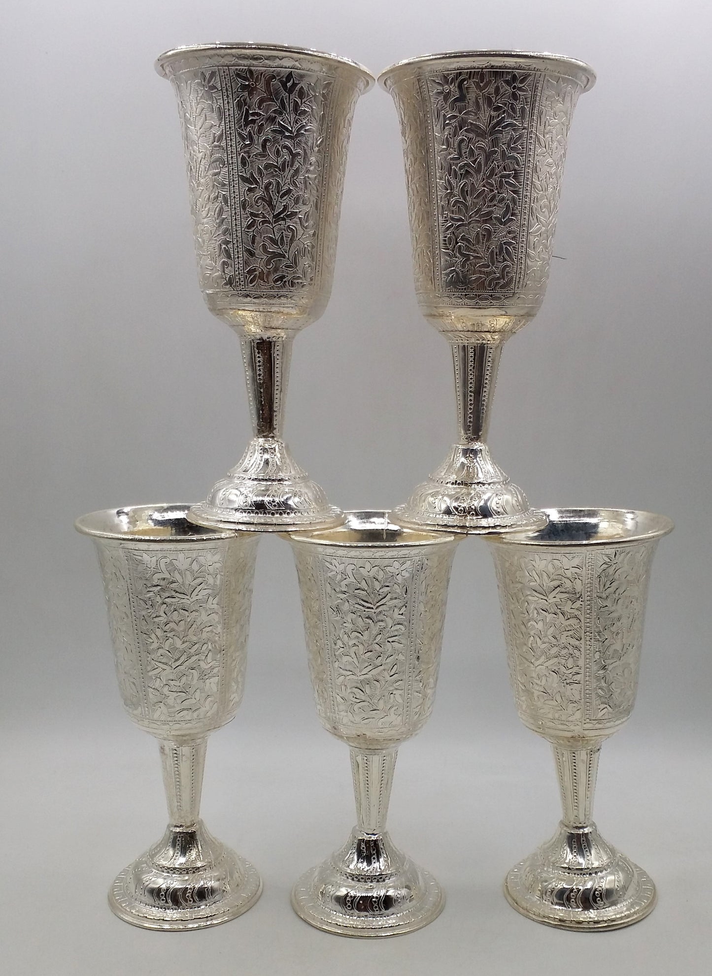 Set of 6 925 sterling silver wine glasses with engraved floral designs by TRIBAL ORNAMENTS, elegant silver drinkware for gifting.