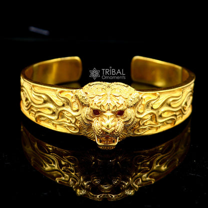 925 Sterling silver lion face cuff bracelet by TRIBAL ORNAMENTS, vintage style men's jewelry with gold polish and solid craftsmanship.