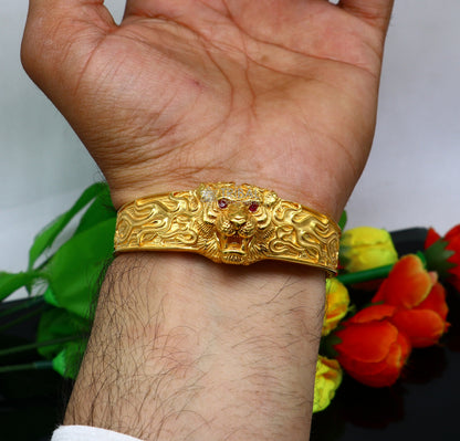 Sterling silver handmade lion face cuff bracelet with gold polish, vintage style men's jewelry, solid band, tribal-inspired design