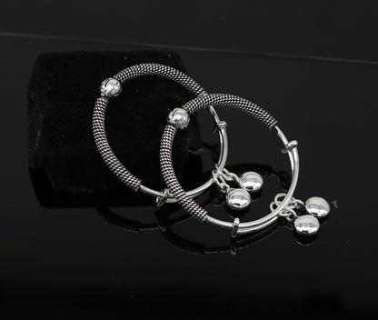 925 silver vintage-style adjustable charm baby bangle by TRIBAL ORNAMENTS, featuring intricate handmade design for newborn kids jewelry.