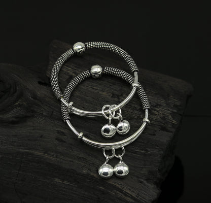 Sterling silver vintage design adjustable baby bangle with charms, handmade tribal jewelry for newborns and kids.