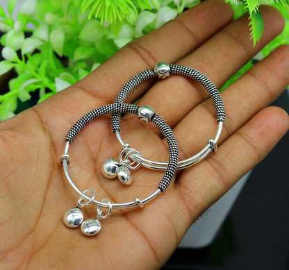 Sterling silver vintage-style adjustable baby bangle with charm, handmade tribal ornament jewelry for newborns and kids.