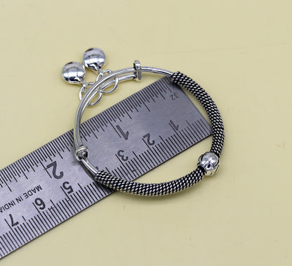 Sterling silver vintage adjustable baby bangle with charm, handmade tribal design for kids jewelry by TRIBAL ORNAMENTS.