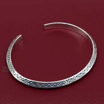 Sterling silver vintage design cuff bracelet by TRIBAL ORNAMENTS, unisex handmade jewelry with intricate detailing and stylish appeal.