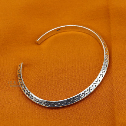 Sterling silver vintage design cuff bangle by TRIBAL ORNAMENTS, unisex handmade jewelry with intricate detailing and stylish appeal.