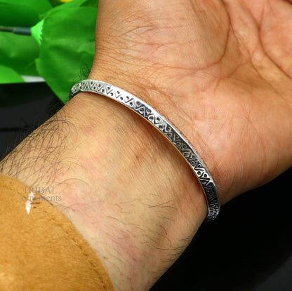 Sterling silver vintage design cuff bangle bracelet by TRIBAL ORNAMENTS, unisex jewelry with intricate handcrafted details.