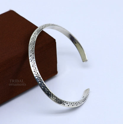 Sterling silver vintage cuff bracelet by Tribal Ornaments, unisex handmade bangle with intricate design, stylish jewelry gift.