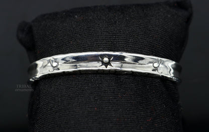 Sterling silver vintage cuff bracelet by TRIBAL ORNAMENTS, unisex stylish handmade jewelry with intricate design and fancy finish.