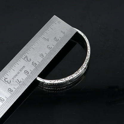 Sterling silver vintage cuff bracelet by TRIBAL ORNAMENTS, unisex stylish handmade jewelry with intricate design and elegant finish.