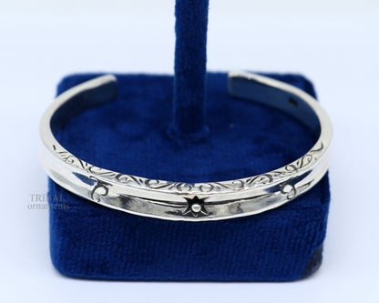 Sterling silver vintage cuff bracelet by TRIBAL ORNAMENTS, unisex stylish handmade jewelry with intricate design.