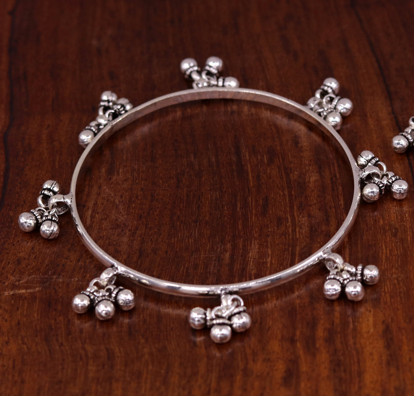 Sterling silver handmade charm bangle bracelet with tribal design by TRIBAL ORNAMENTS, perfect for tribal belly dance jewelry.