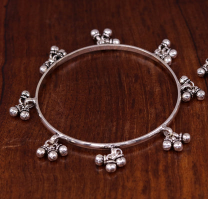 Sterling silver handmade charm bangle bracelet with tribal design by TRIBAL ORNAMENTS, perfect for tribal belly dance jewelry.