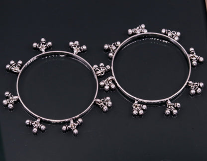 Sterling silver handmade charm bangle bracelet with tribal design by TRIBAL ORNAMENTS, perfect for tribal belly dance jewelry.