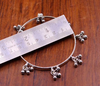 Sterling silver handmade tribal bangle bracelet with charm design, perfect for tribal belly dance jewelry or special gift.