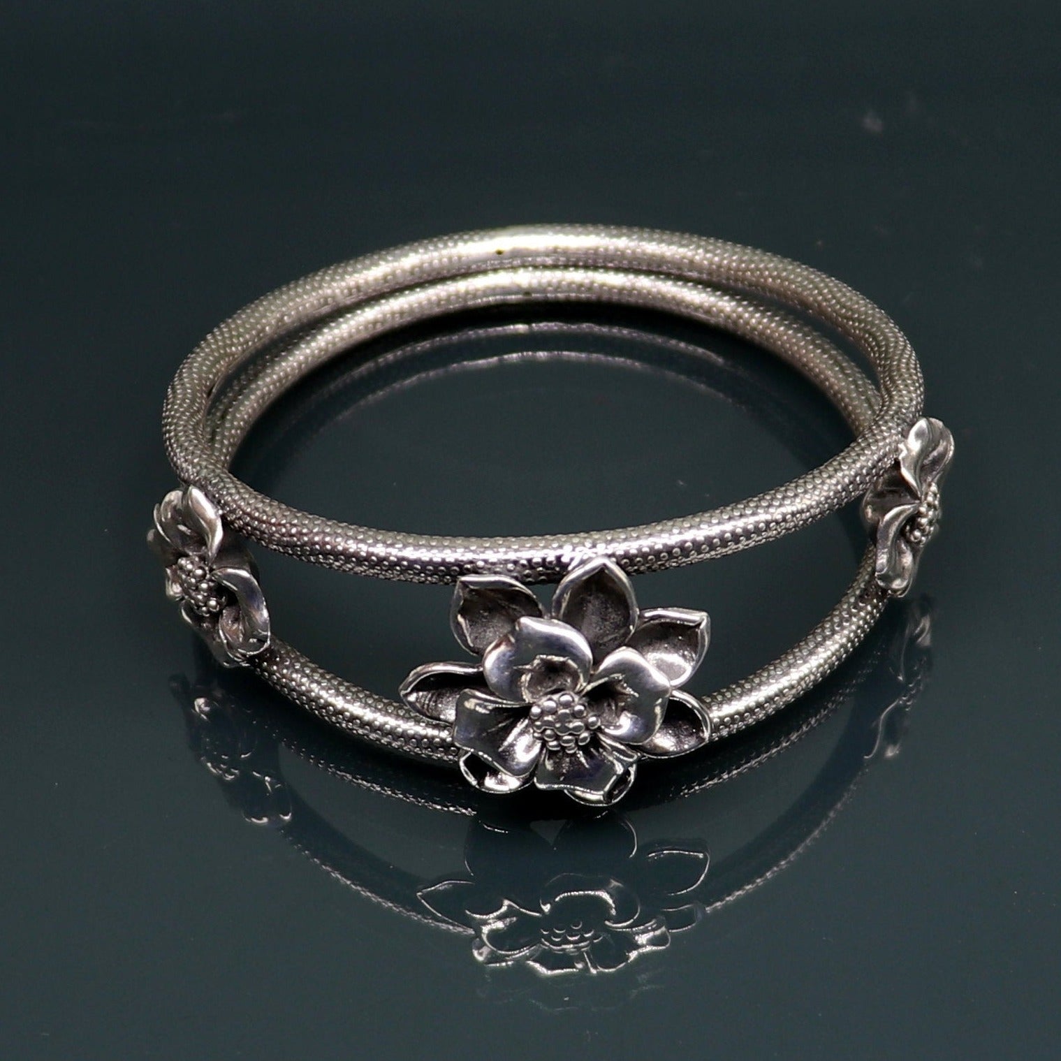 Handmade 925 sterling silver vintage flower design bangle bracelet by TRIBAL ORNAMENTS, traditional wedding jewelry style.