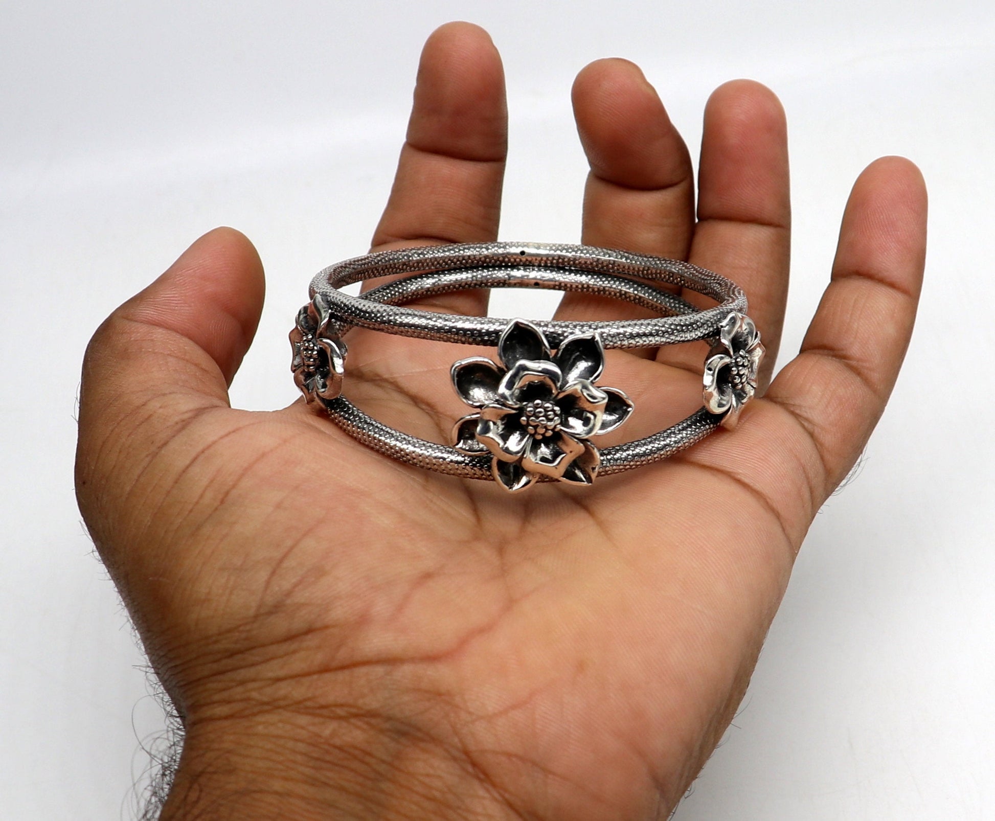 Handmade 925 sterling silver bangle bracelet with intricate flower work, vintage traditional wedding jewelry by Tribal Ornaments.