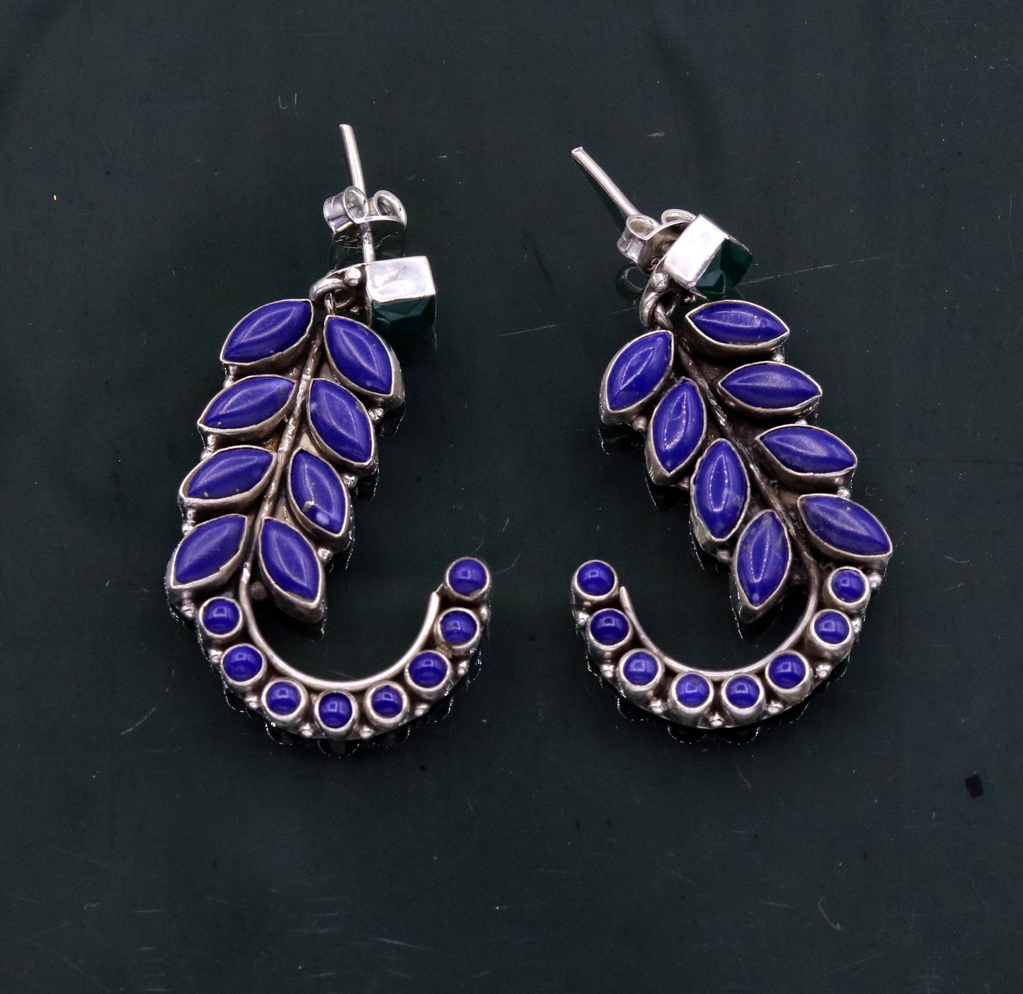 Sterling silver handmade leaf-style gemstone jadau stud earrings by TRIBAL ORNAMENTS, elegant silver jewelry for gifting.