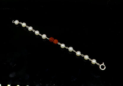 Sterling silver baby bracelet with white pearl beads and Rudraksha, handcrafted kids jewelry by TRIBAL ORNAMENTS.