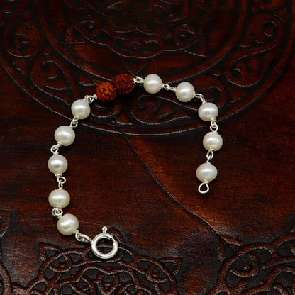 Sterling silver baby bracelet with white pearl beads and Rudraksha, handmade children's jewelry by TRIBAL ORNAMENTS.