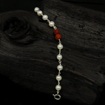 Sterling silver baby bracelet with white pearl beads and Rudraksha, handmade kids jewelry by TRIBAL ORNAMENTS.