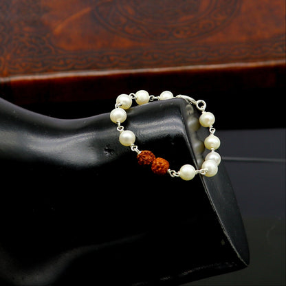 Sterling silver baby bracelet with white pearl beads and Rudraksha, handmade tribal jewelry for kids by TRIBAL ORNAMENTS