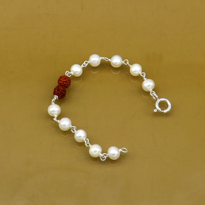 Sterling silver baby bracelet with white pearl beads and Rudraksha, handmade kids jewelry by Tribal Ornaments.