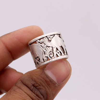 Unisex 925 sterling silver handmade ring with detailed horse, camel, and elephant design, adjustable band by TRIBAL ORNAMENTS.